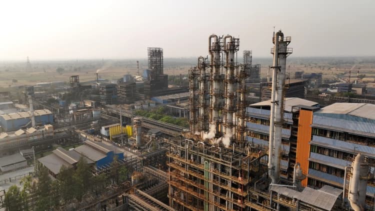 Employees working together in Aarti Industries operational and production area