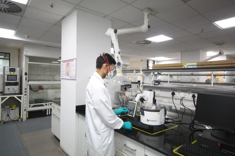 Workers wearing PPE at Aarti Industries manufacturing and processing plant