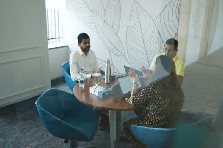 Aarti Industries employees in safety gear performing maintenance on chemical equipment